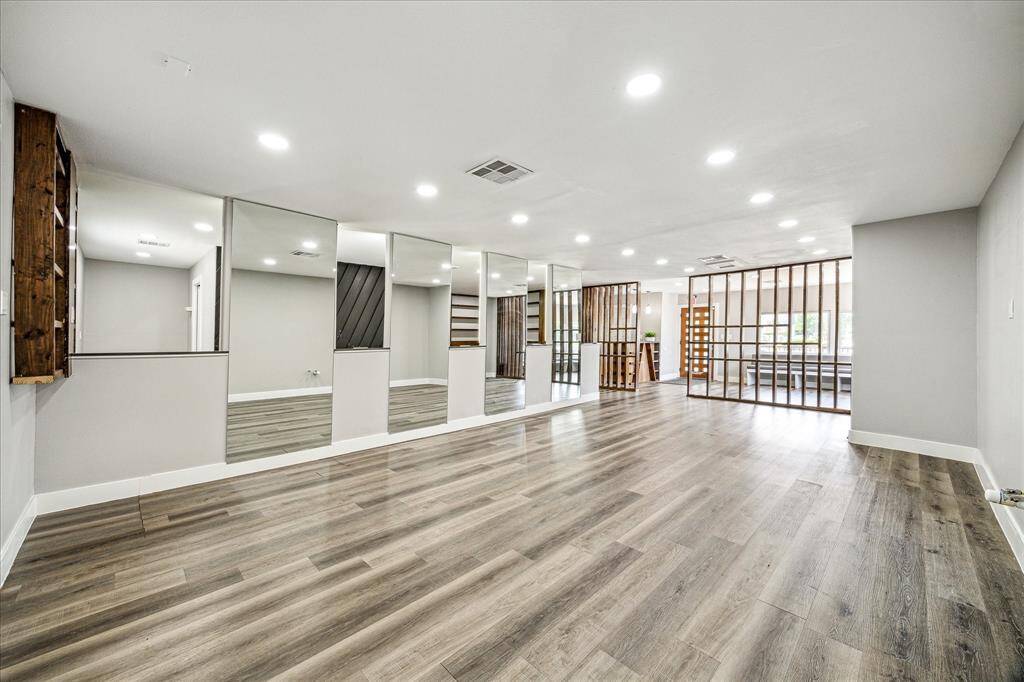 Open, airy interior with mirrors adding depth and light.