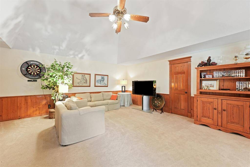 Large open second floor game room.  There is more storage space behind the door.