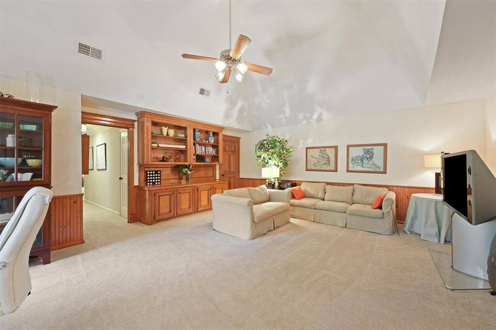 Another view of the game room with built-in shelves.