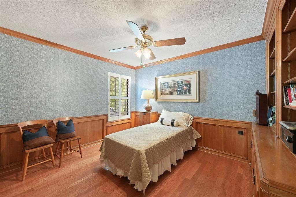 Third bedroom with built-in shelves. Can be used as another home office.