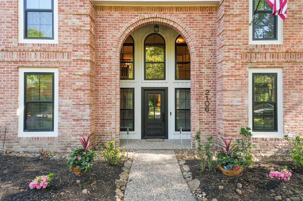 Covered entry with a energy efficient iron front door with an operable window. All windows are Pella fiberglass low E double pane windows.