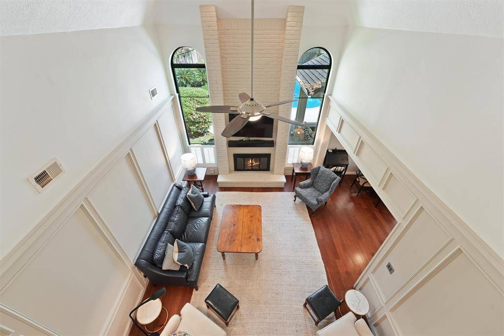 A view to the living area from the second floor hall.