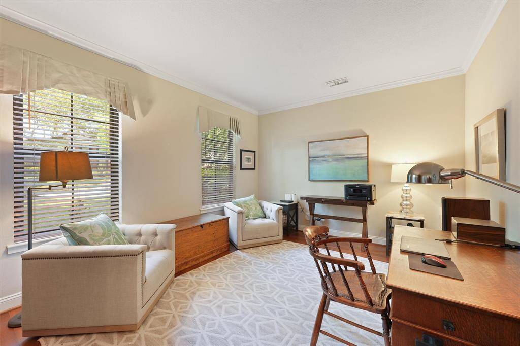 The study has lots of natural light and  room to work or just read a book.