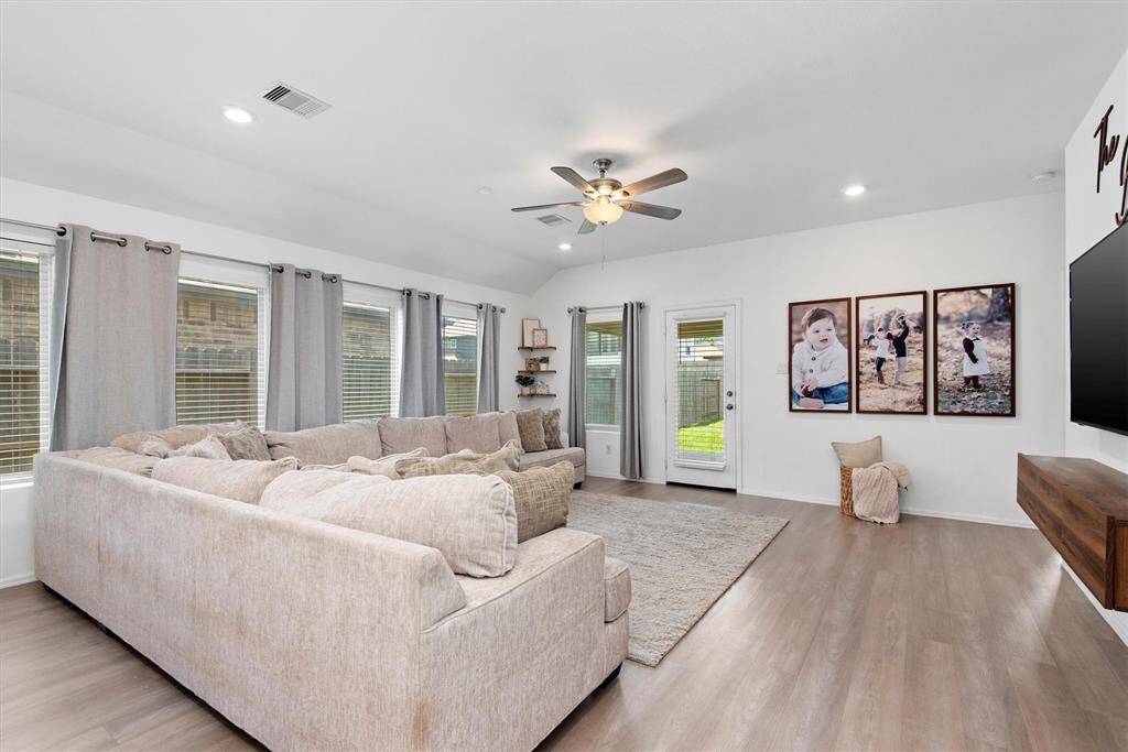 FAMILY ROOM IS OVERSIZED WITH 2” BLINDS