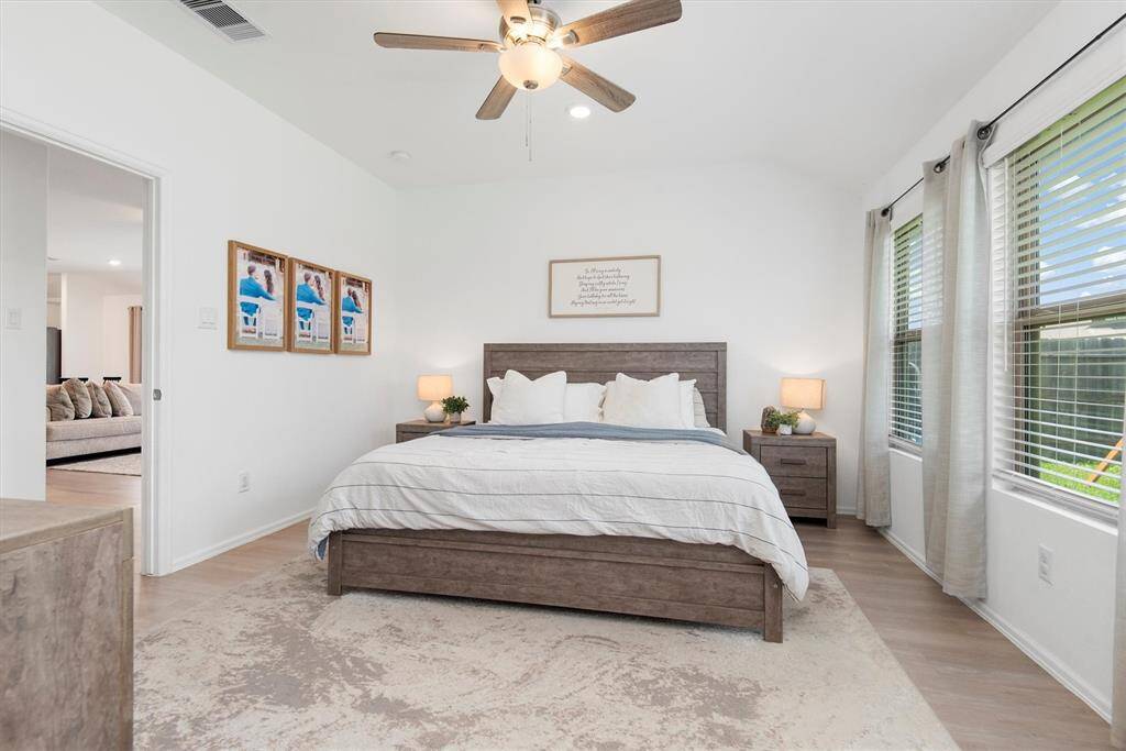 PRIMARY BEDROOM IS PRIVATE IN BACK WING OF THE HOME