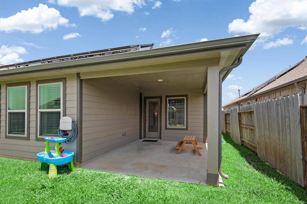 COVERED PATIO WITH HOUSE GUTTERS