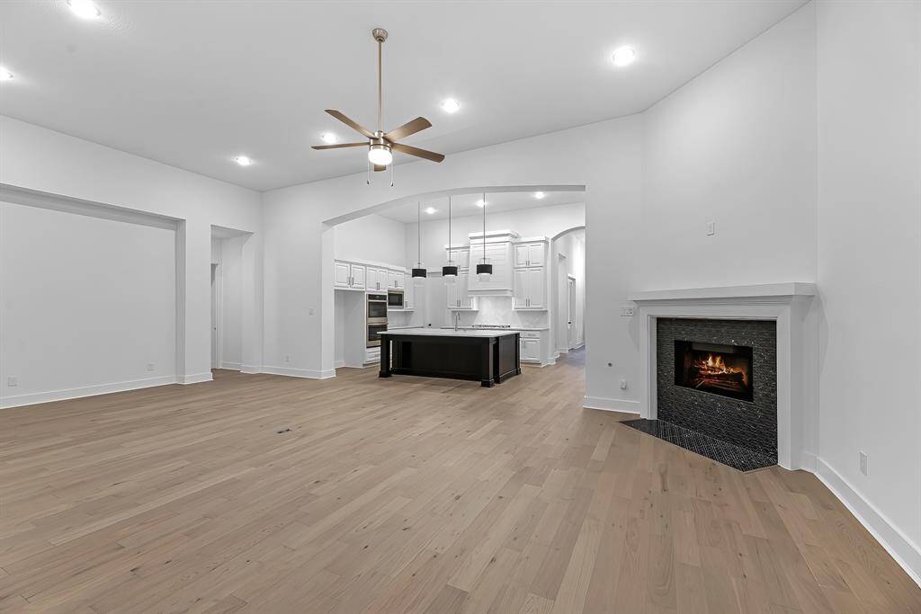 View of the family room from the back of the home. Look at the abundance of entertaining space!