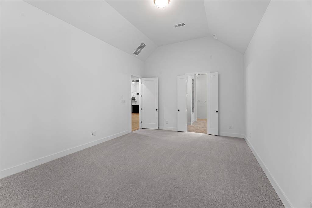 Additional view of the primary bedroom showing the entrance to your ensuite bathroom.