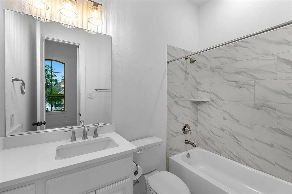 View of the ensuite bathroom for guest bedroom #1.