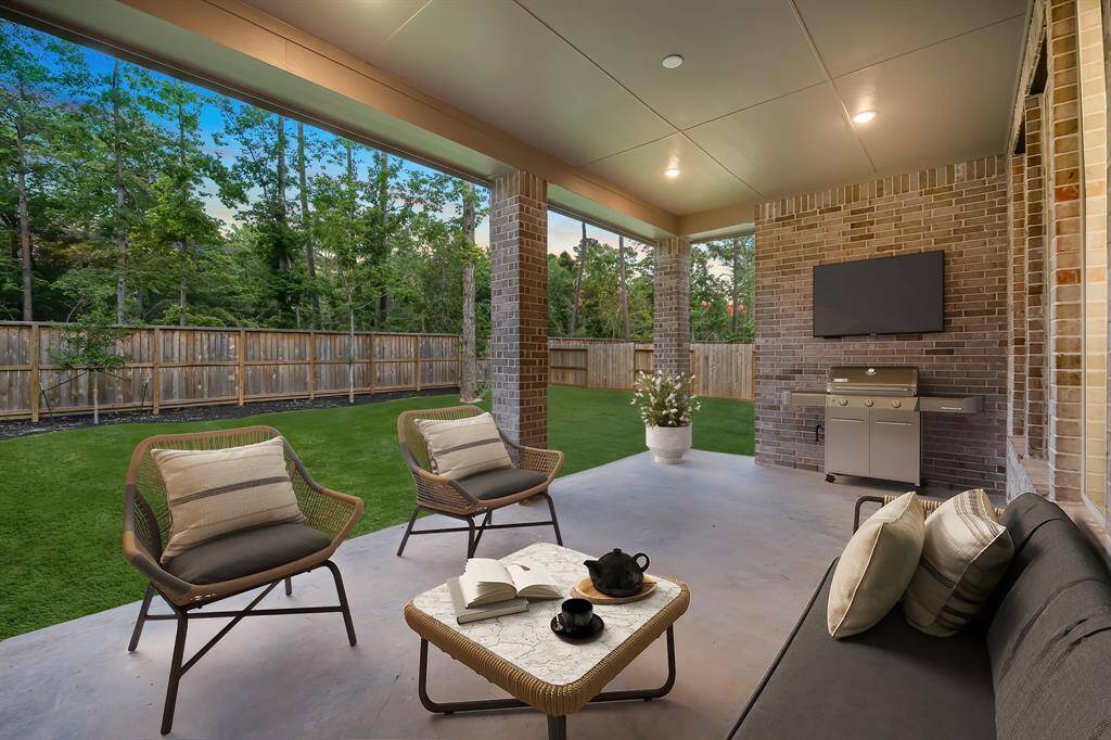Beat the Texas heat on this TEXAS sized covered back patio! Virtually staged to show furniture placement.