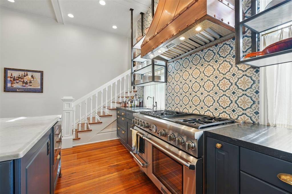 A rare original feature, the dual-sided staircase allows seamless access between formal and private spaces — offering architectural character and functional flow.