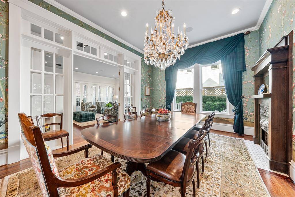 Period-inspired details enrich the room’s timeless elegance. Part of the original 1903 layout, the formal dining room embodies the grace of turn-of-the-century entertaining and now seamlessly opens to the newly added living room—creating a harmonious blend of historic charm and modern living.