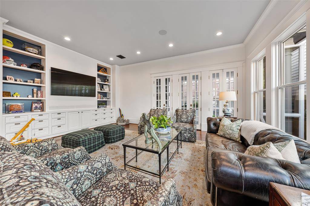 Designed for modern living, the family room is a comfortable, light-filled gathering space. With ample storage, space for media, and a seamless connection to the dining area, it balances tradition and lifestyle with ease.