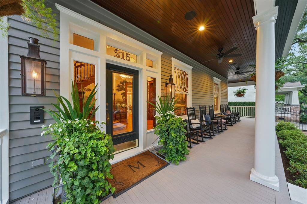 Elegance is evident from the first glance. The original siding and windows were carefully removed, restored, and reinstalled — a true labor of love. The original side lights and transom surrounding the front door remain intact, now complemented by hand-crafted Bevolo copper gas lanterns that add timeless Southern flair.
