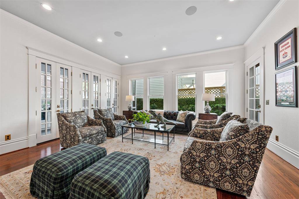 If you're craving even more light and openness, the family room leads directly to the screened-in porch, extending the living experience outdoors.