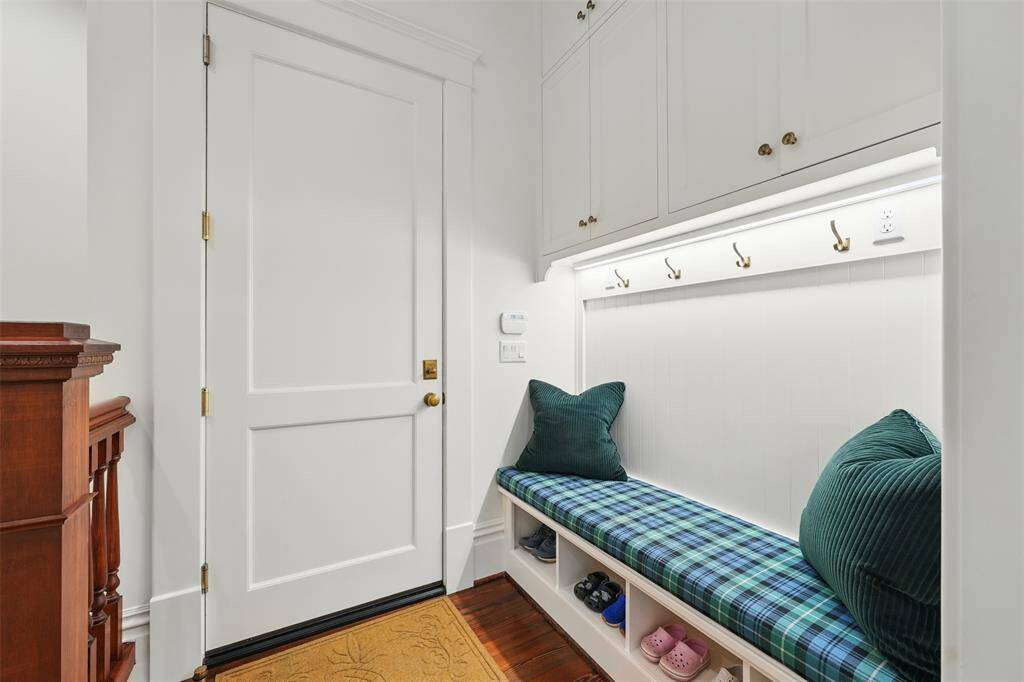 A smart and stylish landing zone. Located just off the garage, this mudroom is perfect for stashing coats, bags, or gear while maintaining the home’s clean, organized aesthetic.