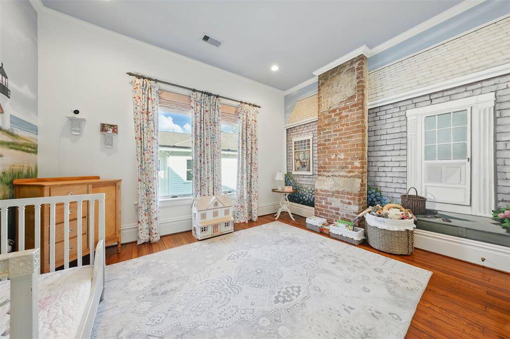 This light-filled bedroom blends whimsy and warmth. Hardwood floors and charming finishes complete a space that’s as playful as it is timeless.
