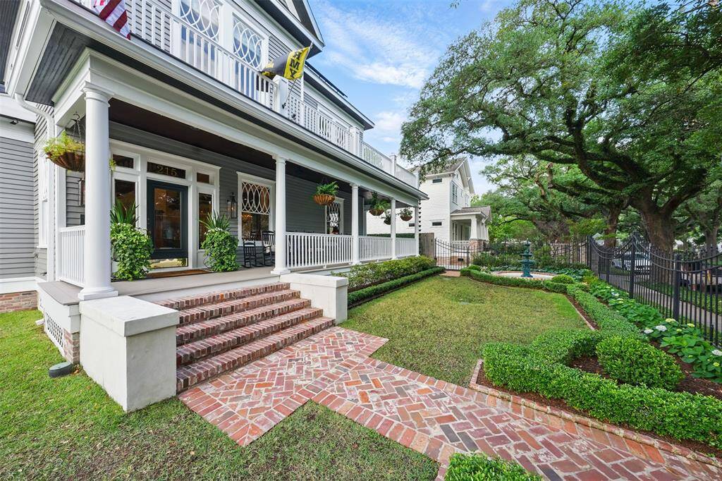 Every element of the approach to this historic home speaks to timeless craftsmanship and thoughtful design. The original windows frame the façade with character, while the recently added herringbone brick pathway and broad, gracious steps create an elegant welcome. Above the sweeping wraparound porch, a second-story balcony offers a serene perch to take in the charm of tree-lined Bayland Avenue.Every element of the approach to this historic home speaks to timeless craftsmanship and thoughtful design.
