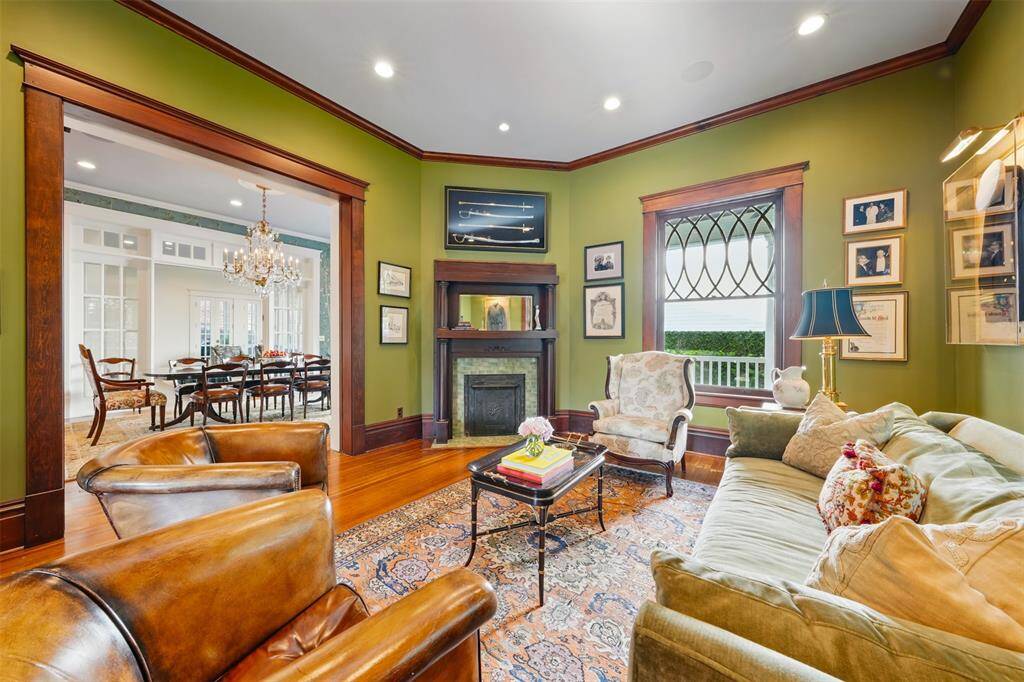 Just beyond the parlor, the gracious formal dining room awaits. Ideal for hosting gatherings both intimate and grand.