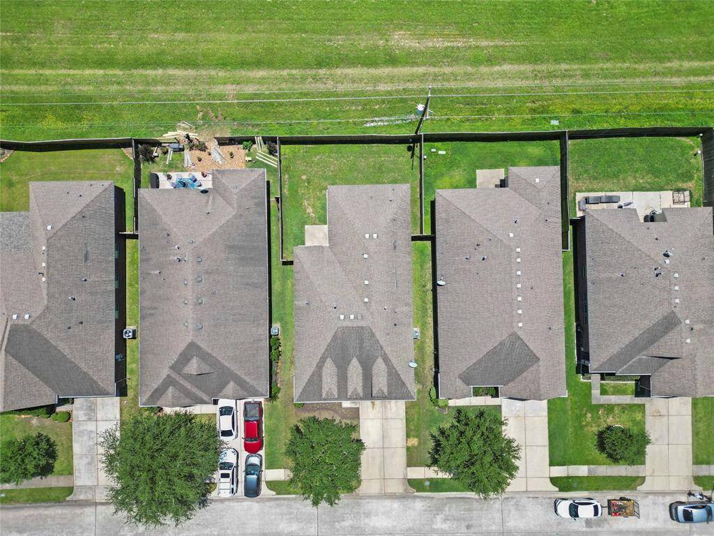 The aerial view highlights your private backyard that opens directly to the greenbelt—perfect for enjoying a peaceful setting without any rear neighbors.