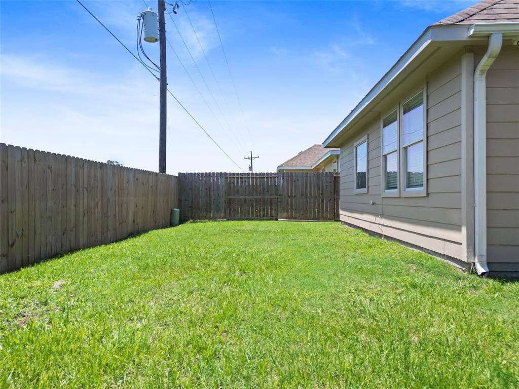 The fenced backyard gives you a private outdoor space to enjoy the fresh air—perfect for gardening, entertaining, or simply relaxing with your morning coffee.