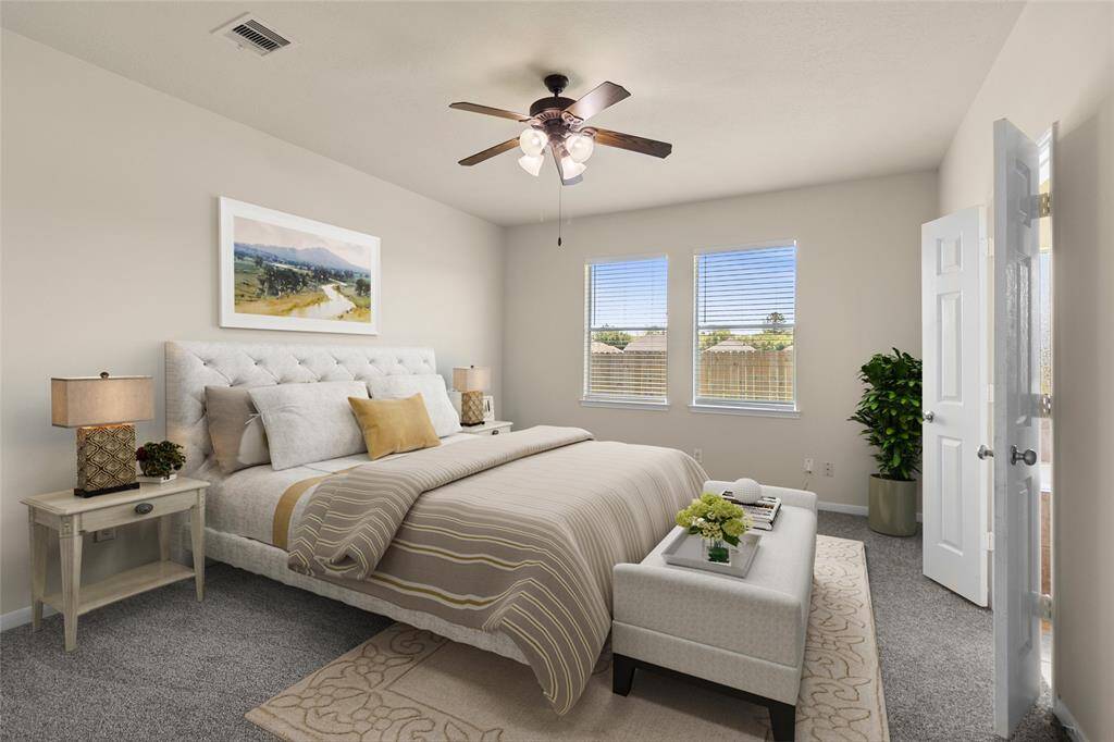 Your primary bedroom is a peaceful retreat, filled with soft natural light and plenty of space to wind down or start your day refreshed. It's where comfort meets calm, right at the heart of your home.