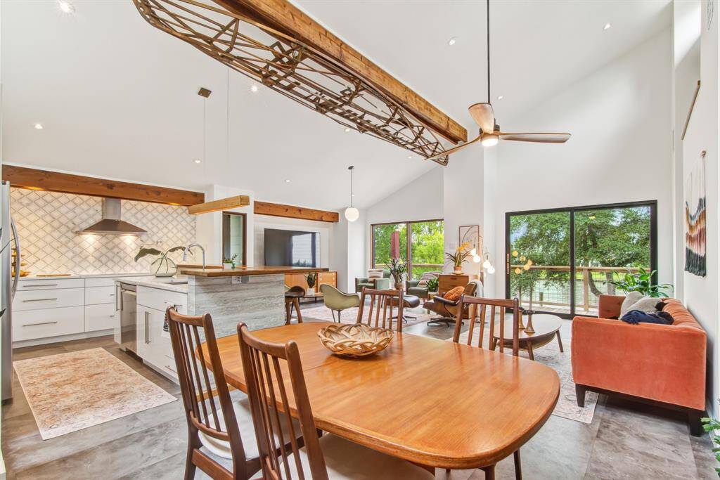 Water views from the living space and large deck with two hurricane sliding doors. Reclaimed beam in ceiling and antique canoe frame feature add to the nautical vibes!