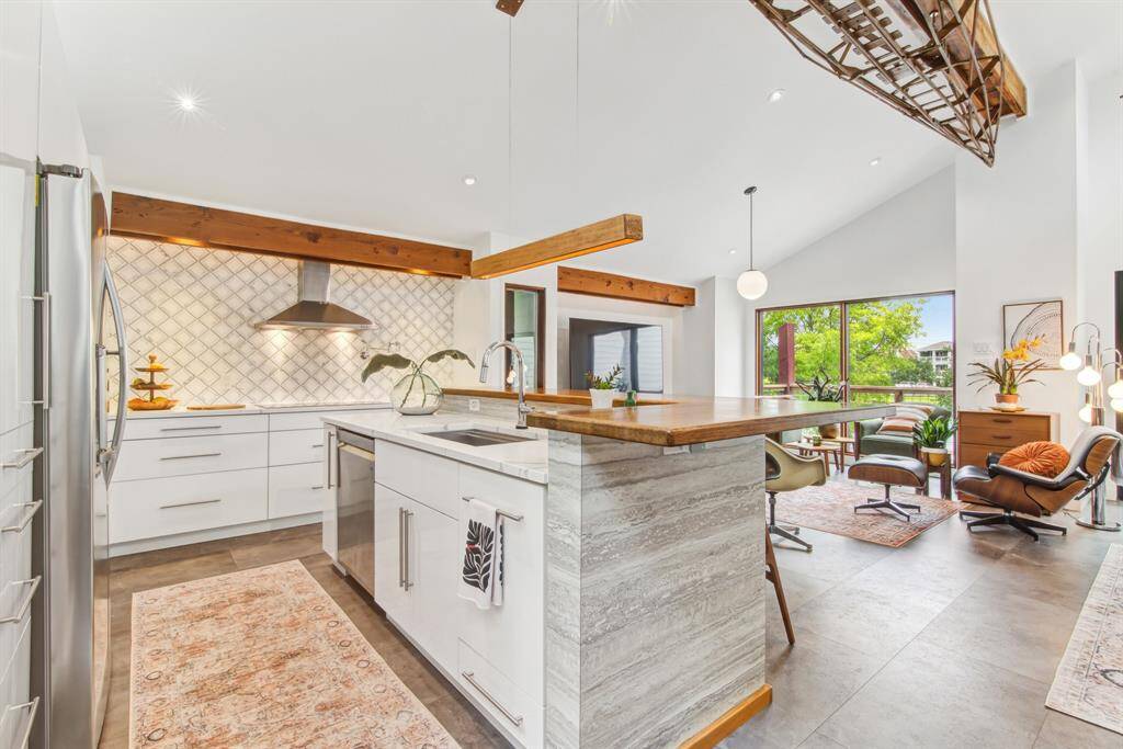 Gorgeous open kitchen with custom, soft close cabinetry, custom English oak and quartz counter tops, LG appliances and induction cook top.