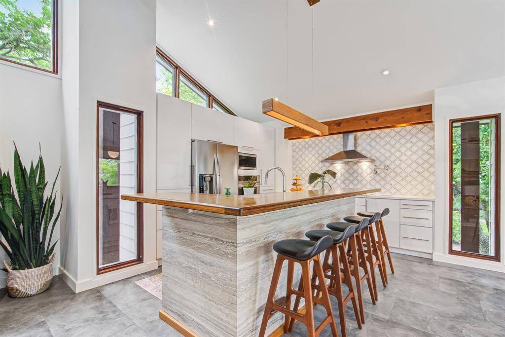 Entertain your guests at this elegant reclaimed English oak bar counter top. Stylish kitchen has all the latest upgraded aesthetics and appliances.