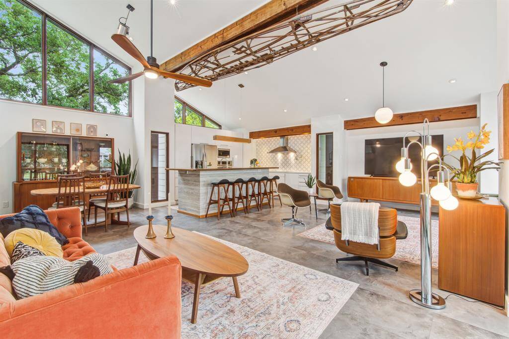 Plenty of room for a variety of furnishings. Antique canoe frame attached to reclaimed beam at ceiling will remain.
