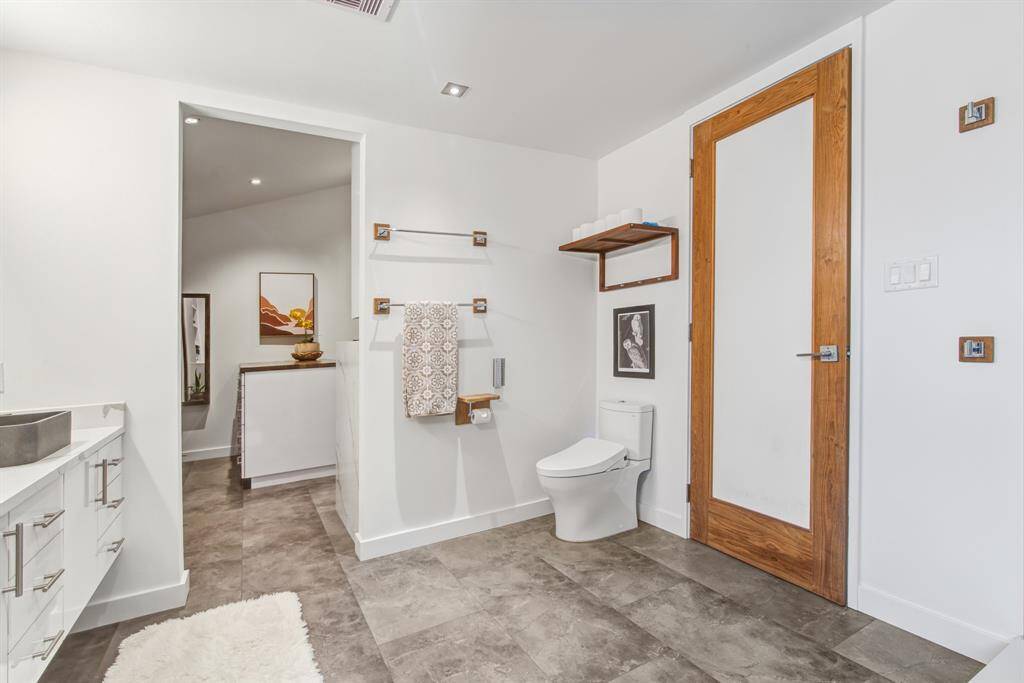 Primary bathroom 'throne' is self cleaning with bidet feature and customized remote control settings.
