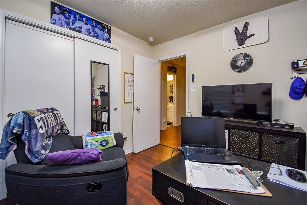 Printer and files are stored in the closet.