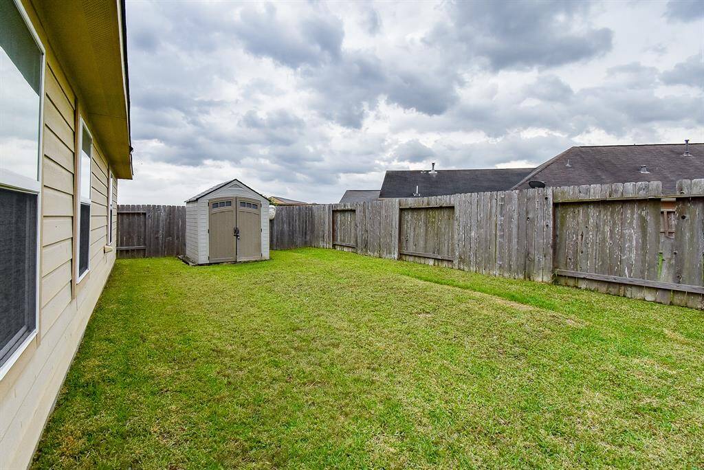 Side gate on the right accesses the backyard