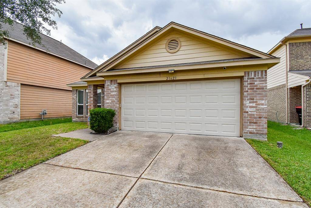 Double driveway, 2-car garage w/remote entry