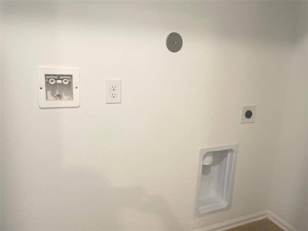 Washer and dryer hook ups located inside.