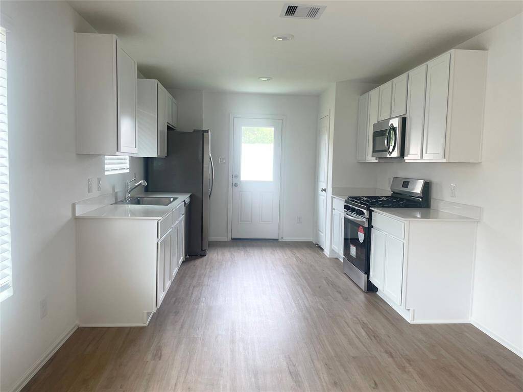 Kitchen has marble counters and all stainless steel appliances!