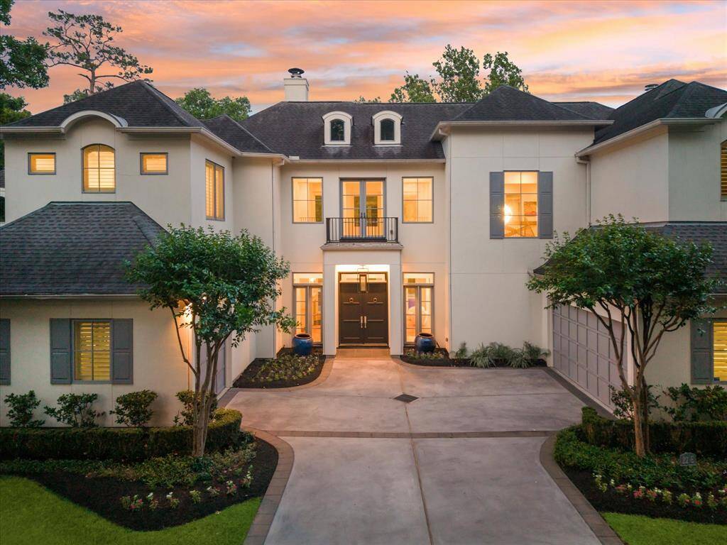 Located at the end of a secluded gated drive, this spectacular home blends French style with modern tastes seamlessly with a stunning forested backdrop.