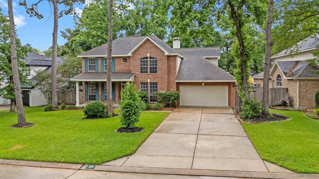 Charming two-story brick home with a spacious driveway and a three car attached tandem garage. Nestled among mature trees, it features a well-maintained front lawn and a welcoming porch. Ideal for those seeking a serene, suburban setting.