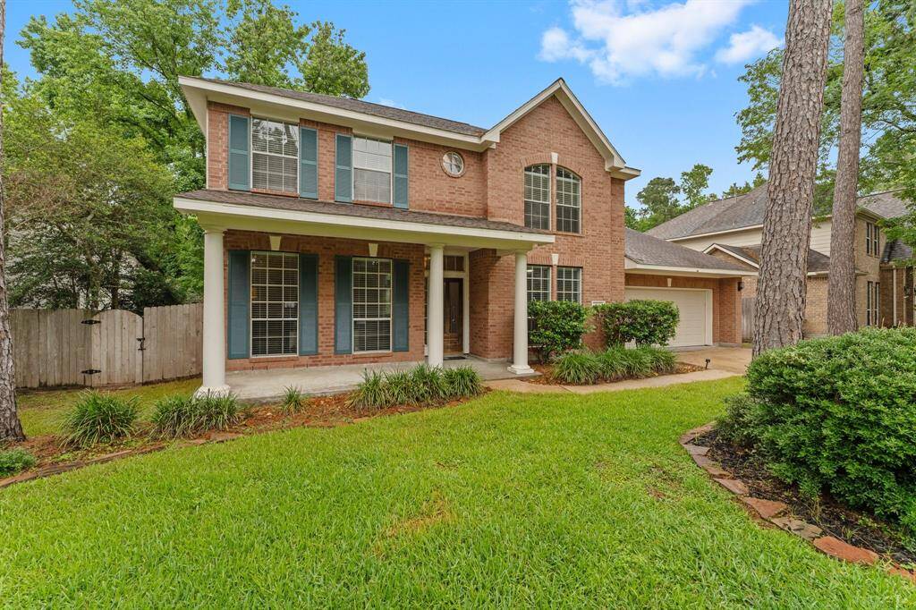 Charming two-story brick home with a welcoming porch, set on a spacious lot. Features a well-maintained lawn, mature trees, and a three-car garage. Perfect for families seeking a serene neighborhood setting.