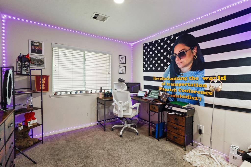 Sure! Here's a more compelling description:"Versatile bedroom with ample natural light, perfect for a cozy retreat or home office setup.