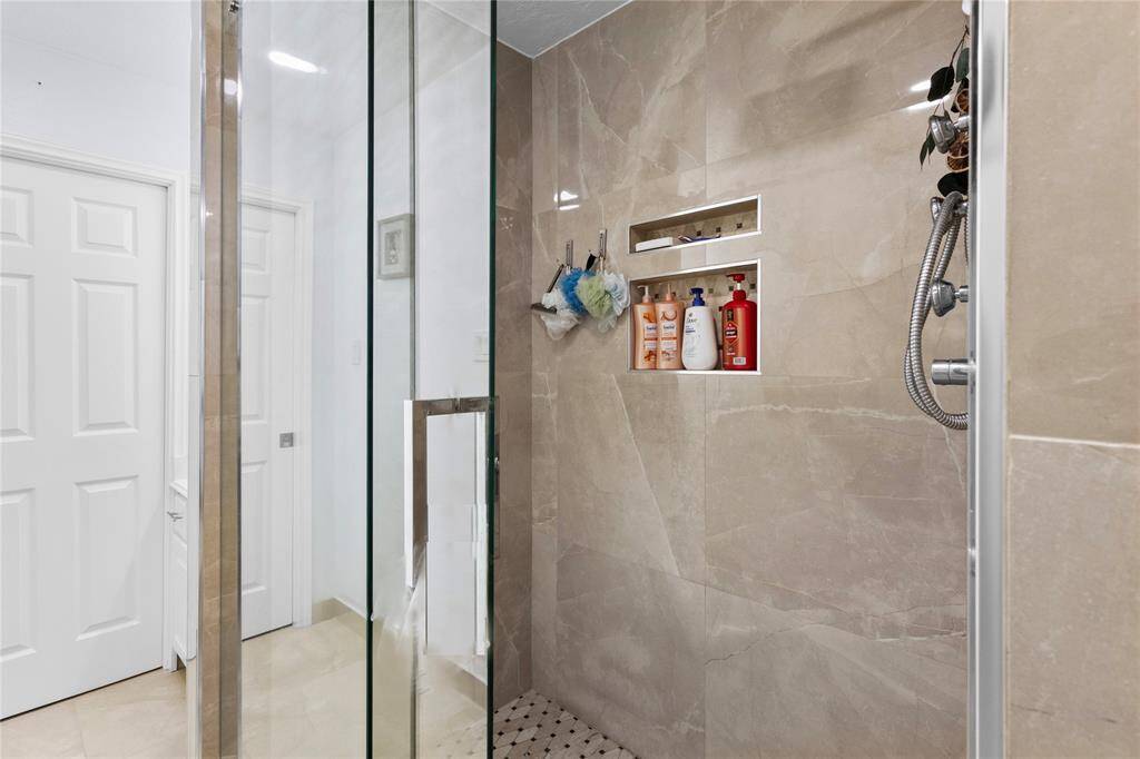Luxuriously renovated guest shower.