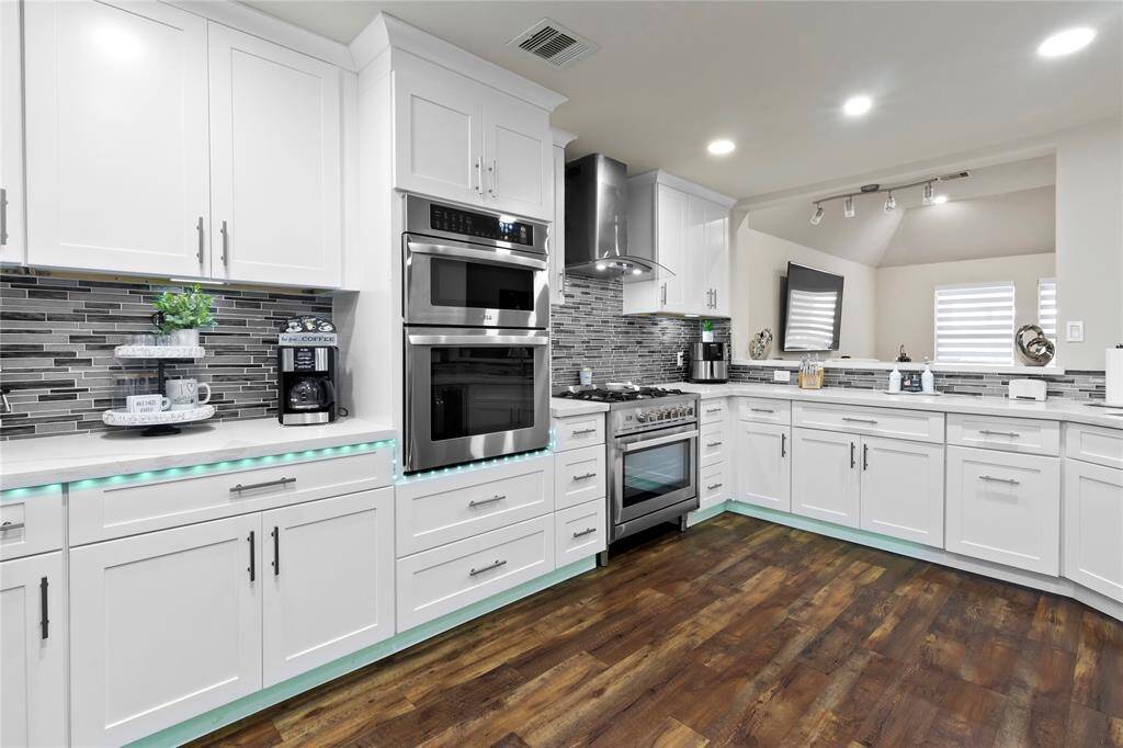 Stunning, modern kitchen with sleek finishes and top-of-the-line appliances.