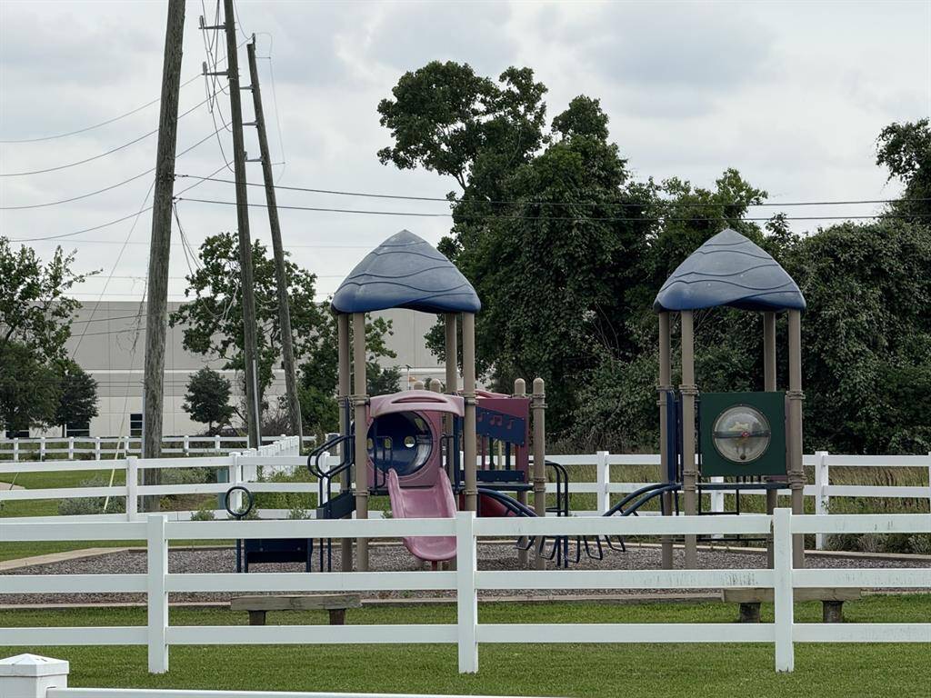 Charming neighborhood park with a playground, perfect for family fun.