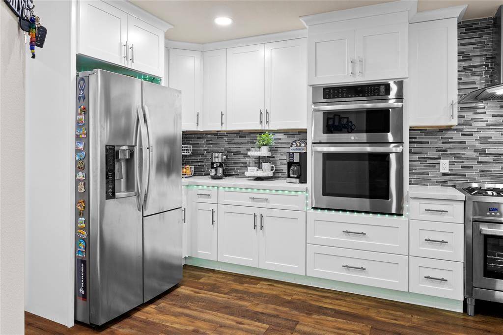 Stunning kitchen with modern fixtures, abundant natural light, and generous storage.