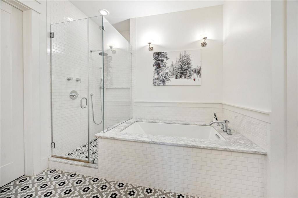 Primary ensuite has a large walk in shower and soaking tub