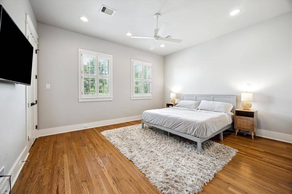 The primary bedroom has even more space and plenty of light overlooking Oxford Street
