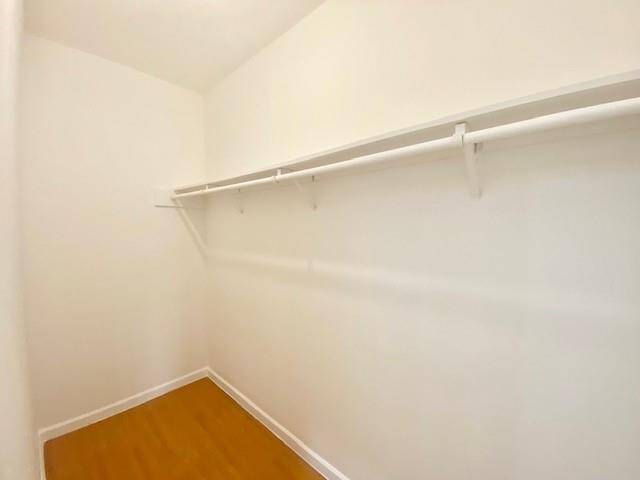 Primary bedroom walk in closet.