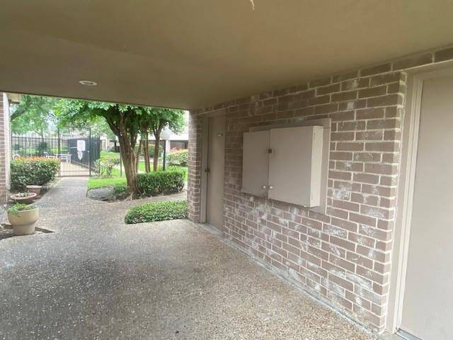 Location of supra in wood cabinet near pool.
