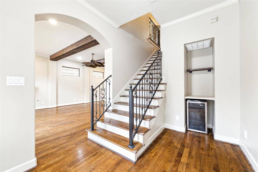 Flex space just off the family room, with stairs leading to the three bedrooms on the third floor. A beverage refrigerator is also included.