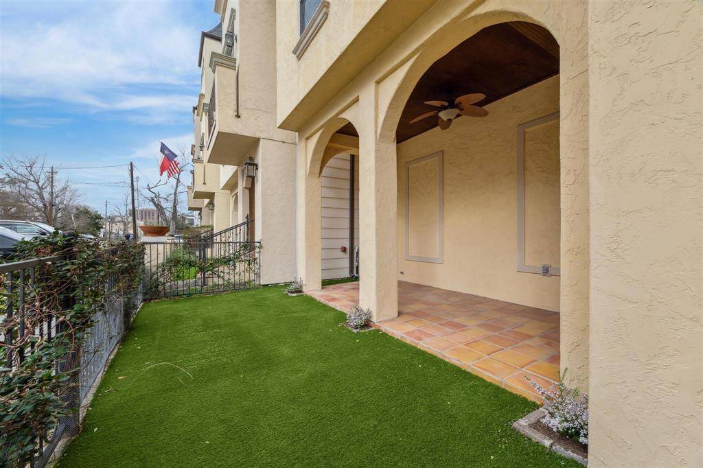 Inviting view upon entering the wrought iron gates, featuring low-maintenance turf — perfect for easy care and a beautiful outdoor space.